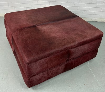 Lot 311 - A COW HIDE UPHOLSTERED SQUARE CENTRE STOOL OR...