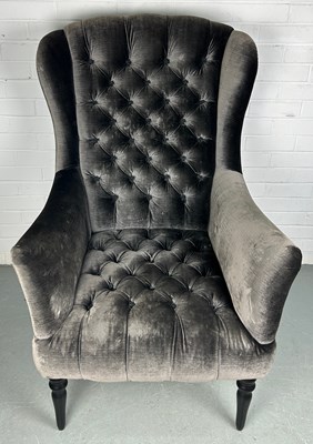 Lot 313 - JOHN SANKEY: A WINGBACK ARMCHAIR ON FOUR...