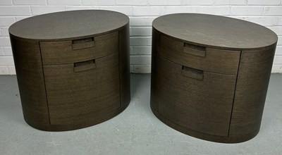 Lot 317 - A PAIR OF BROWN OVAL WOODEN BEDSIDE CABINETS...