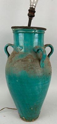 Lot 45 - A LARGE BLUE GLAZED CERAMIC JUG WITH FOUR LUG...