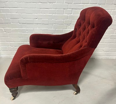 Lot 121 - A DEEP SEATED VICTORIAN ARMCHAIR UPHOLSTERED...