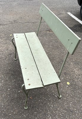 Lot 128 - A GREEN PAINTED IRON GARDEN BENCH WITH WOODEN...