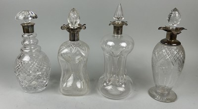 Lot 302 - A GROUP OF FOUR DECANTERS WITH SILVER COLLARS (4)