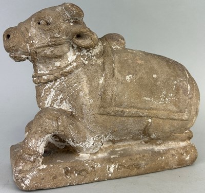 Lot 198 - A TIBETAN OR INDIAN STONE COW, 

23cm x 19cm