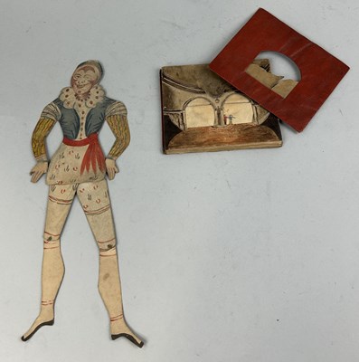 Lot 462 - AN VICTORIAN HAND PAINTED 'PEEP SHOW' THEATRE ALONG WITH AN ARTICULATED PAINTED FIGURE (2)