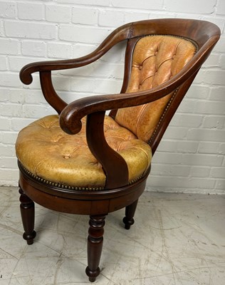 Lot 470 - A CAPTAINS SWIVEL CHAIR WITH TAN LEATHER...