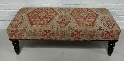 Lot 522 - AN OTTOMAN FOOTSTOOL UPHOLSTERED IN KILIM...