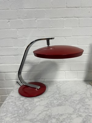 Lot 634 - A CHROME MID CENTURY FASE LAMP WITH RED SHADE...