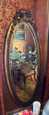 Lot 18 - A LARGE FRENCH OVAL GILT WOOD WALL MIRROR WITH...