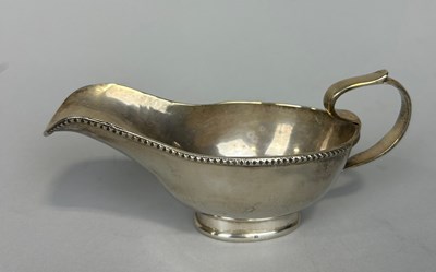 Lot 148 - A SILVER GRAVY BOAT,

Weight: 242gms