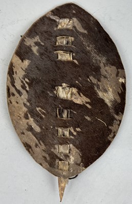 Lot 474 - A TRIBAL ANIMAL HIDE SHIELD FROM THE COLLECTION OF CAPTAIN JAMES MUDDLE