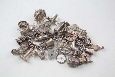 Lot 181 - SILVER CHARM BRACELET WITH TRANSPORT...