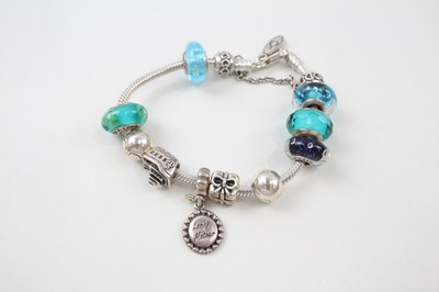 Lot 188 - SILVER PANDORA CHARM BRACELET AND CHARMS...