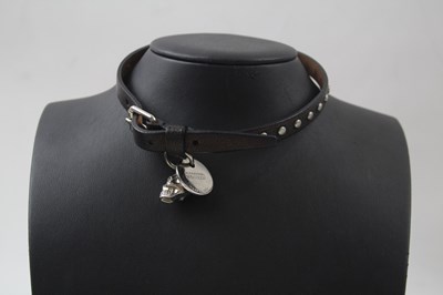 Lot 209 - A LEATHER CHOKER NECKLACE WITH SKULL PENDANT...