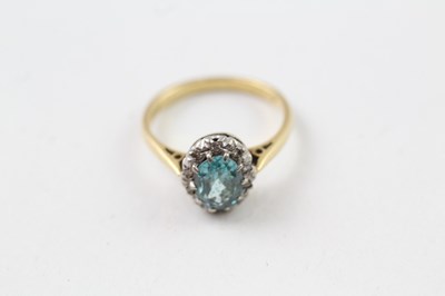 Lot 211 - AN 18CT GOLD, DIAMOND AND ZIRCON OVAL HALO...