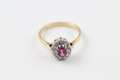 Lot 237 - AN 18CT GOLD, DIAMOND AND RUBY OVAL HALO RING,...