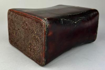 Lot 290 - A JAPANESE RED CINNABAR LACQUERED PILLOW,...