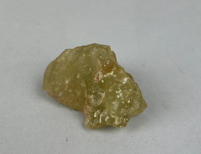 Lot 527 - A LIBYAN DESERT GLASS TEKTITE OR METEORITE,...