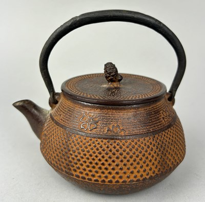 Lot 585 - AN ORIENTAL BRONZE TEA POT AND COVER, 

13cm W