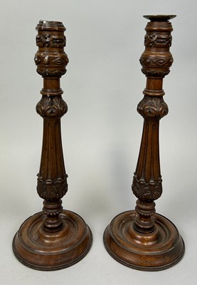 Lot 614 - A PAIR OF CARVED WOODEN CANDLESTICKS, 

37cm H...