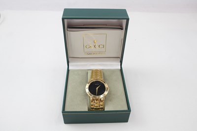 Lot 656 - A GENTLEMAN'S GUCCI 3300.2M GOLD TONE WATCH,...