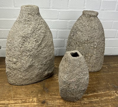 Lot 649 - A SET OF THREE STONE FLASK VASES