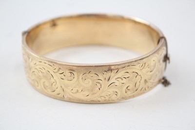 Lot 670 - VINTAGE 1/5 ROLLED GOLD BANGLE WITH SCROLLING...