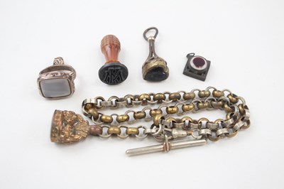 Lot 673 - A COLLECTION OF ANTIQUE FOBS AND WATCH CHAIN...