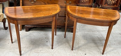 Lot 711 - A PAIR OF GEORGE III DEMI LUNE CARD TABLES...