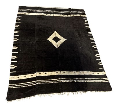 Lot 1142 - TWO DARK MOHAIR RUGS: ONE BLACK AND ONE BROWN NOMADIC ANGORA RUGS