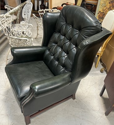 Lot 765 - A GREEN LEATHER BUTTON BACK RECLINING ARMCHAIR,...