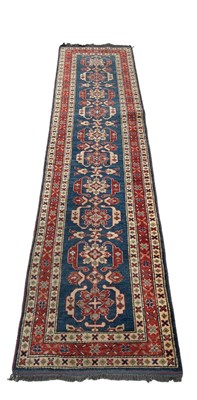 Lot 847 - A PERSIAN DESIGN RUNNER, 

318cm x 74cm