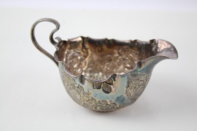 Lot 140 - 925 STERLING SILVER FLORAL CREAM JUG,

Weight:...