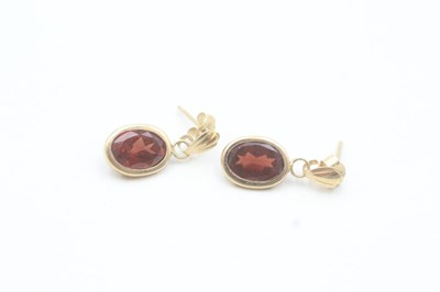 Lot 196 - 9CT GOLD OVAL CUT GARNET DROP EARRINGS...