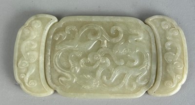 Lot 270 - A CHINESE JADE BELT BUCKLE,
 
In three parts....