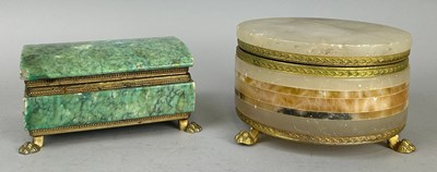 Lot 445 - TWO STONE CASKETS WITH BRONZE LION PAW FEET,...