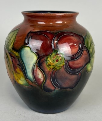 Lot 454 - WALTER MOORCROFT: A MOORCROFT VASE OF FLORAL...