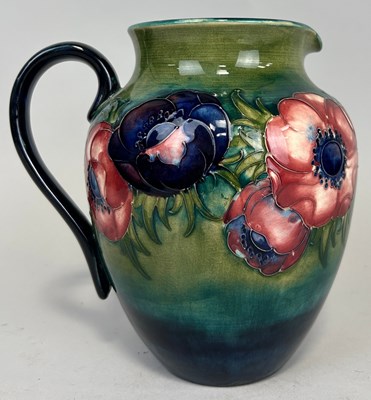 Lot 455 - A MOORCROFT JUG DECORATED WITH FLOWERS, 

21cm H