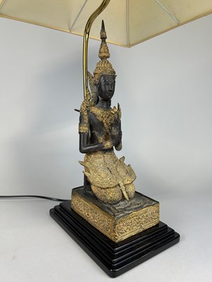 Lot 498 - A THAI BRONZE AND GILT 'BUDDHA' LAMP WITH...