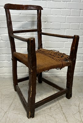 Lot 555 - A PRIMITIVE IRISH SUGAN CHAIR WITH WOVEN ROPE...