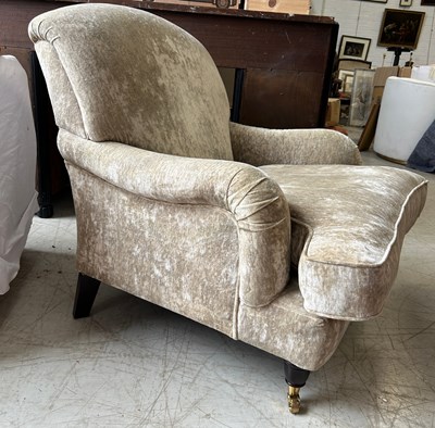 Lot 557 - A VELVET UPHOLSTERED HOWARD STYLE ARMCHAIR,...