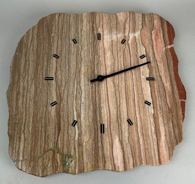 Lot 631 - A POLISHED SAND STONE WALL CLOCK, 

43cm x 43cm