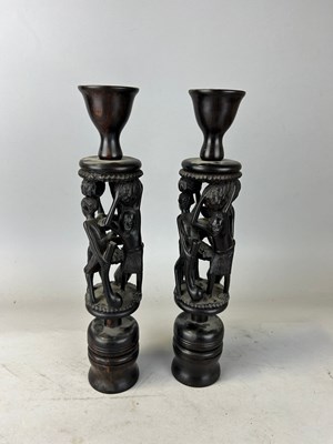 Lot 666 - A PAIR OF AFRICAN WOODEN CANDLESTICKS