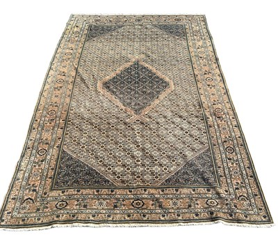 Lot 856 - A PERSIAN DESIGN CARPET,

310cm x 198cm