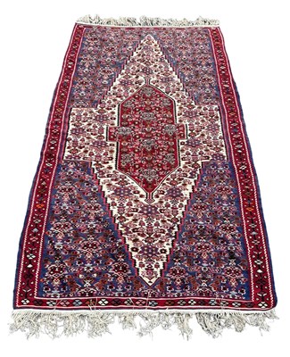 Lot 858 - A PERSIAN DESIGN CARPET, 

197cm x 116cm