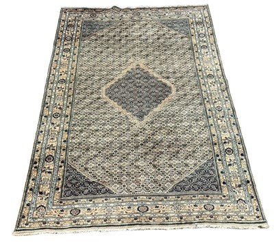 Lot 860 - A PERSIAN DESIGN CARPET, 

300cm x 192cm