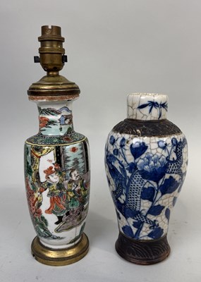 Lot 258 - A CHINESE KANGXI STYLE VASE ADAPTED FOR LAMP ALONG WITH A BLUE AND WHITE CRACKLE VASE