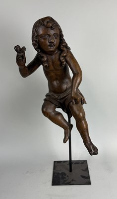 Lot 6 - A 17TH CENTURY OR EARLIER CARVED WOODEN FIGURE OF CUPID