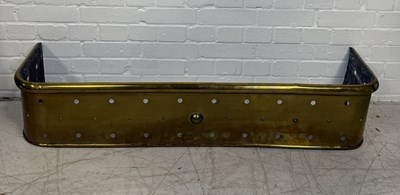 Lot 980 - AN ANTIQUE BRASS FIRE FENDER