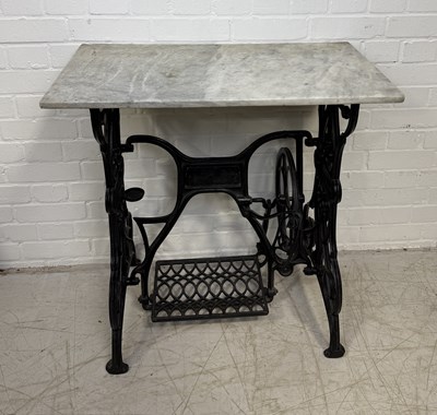 Lot 911 - AN ANTIQUE CAST IRON SEWING TABLE WITH MARBLE TOP